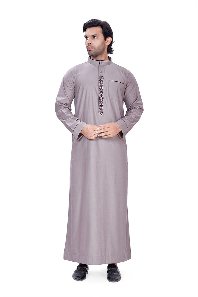 Gray Alqamees thobe featuring intricate black embroidery down the placket and a curved band collar By Zamzam