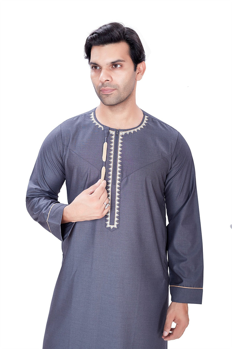 Charcoal grey Moonlight thobe featuring white embroidered details on the neckline and a zipped placket By Zamzam