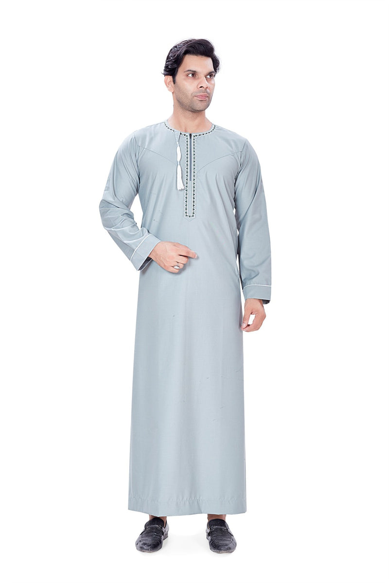 Light grey thobe with white piping and a tassel detail By Zamzam